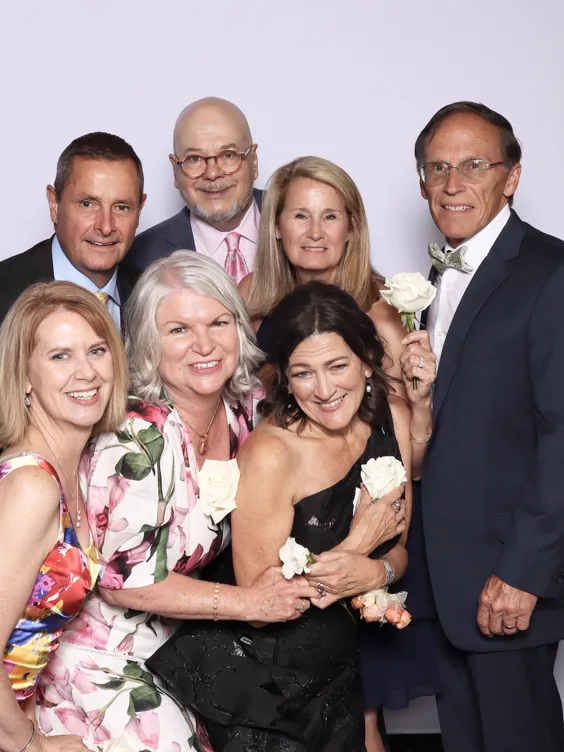 A family group posing together in the open-air photo booth