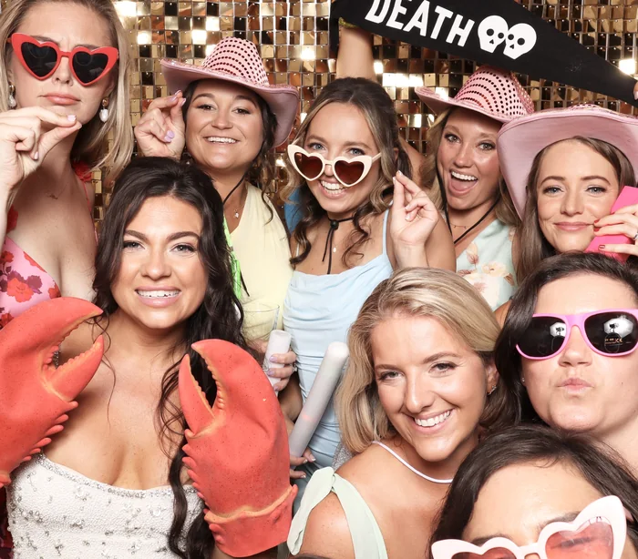 Guests posing together at a Viva Booth Co. photo booth