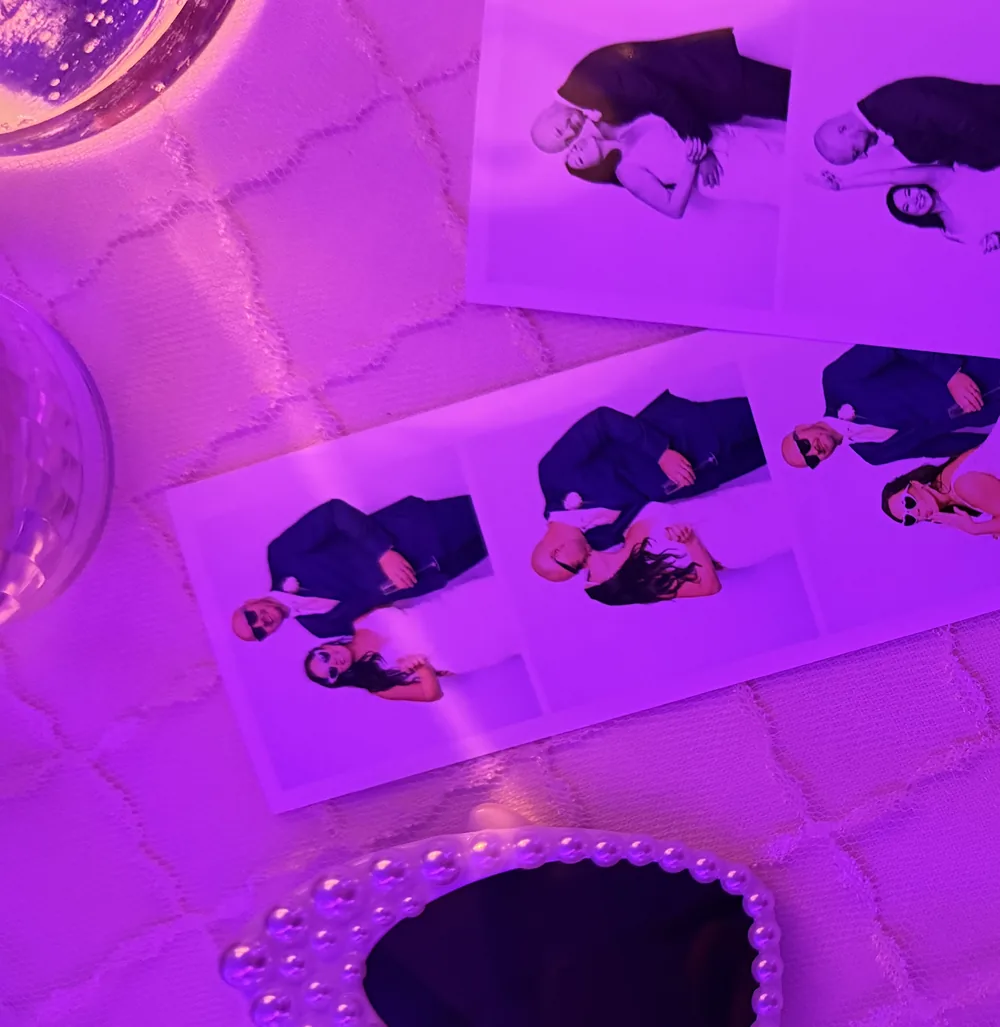 Film strips left on a reception table under coloured party lighting