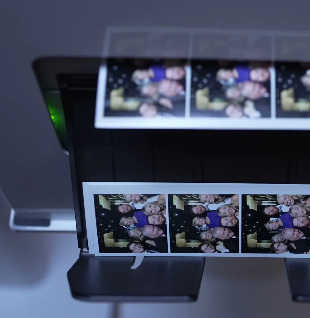 Film strips printing from the Viva Booth Co. photo booth