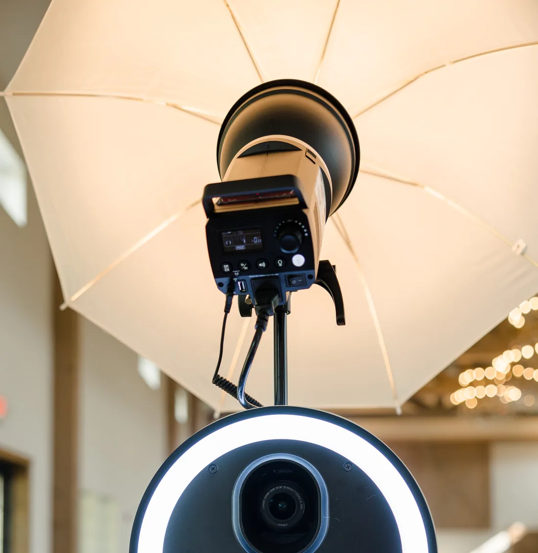 The Viva Booth Co. camera, ring light and umbrella softbox set up in a reception room